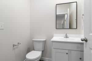 Modern bathroom interior featuring a sleek vanity and minimalist design elements.