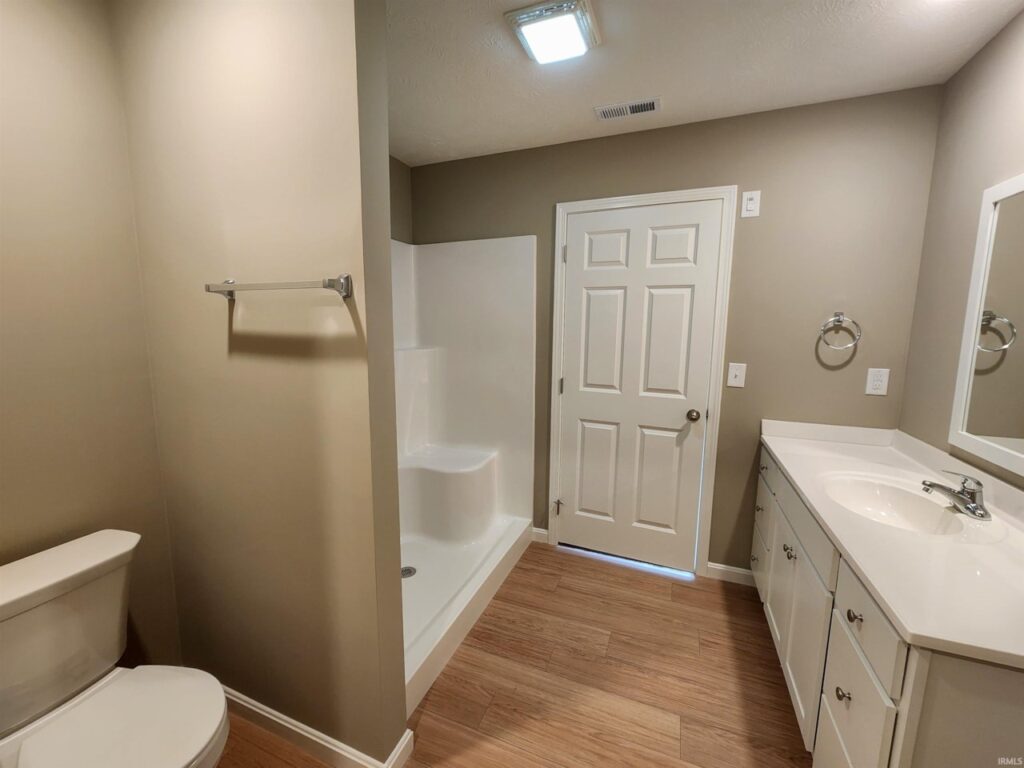 Modern bathroom remodel featuring a shower, vanity, and sleek design elements.
