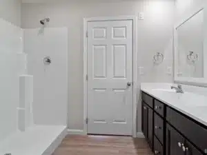 Modern bathroom remodel featuring a sleek shower and stylish vanity cabinetry.