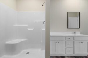 Modern bathroom remodel with sleek shower and stylish vanity for a fresh look.