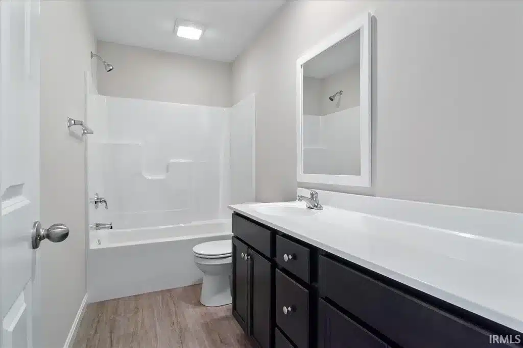 Modern bathroom renovation featuring a sleek design and updated fixtures.