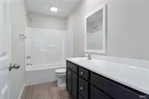 Modern bathroom renovation featuring a sleek design and updated fixtures.