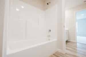 Modern bathtub installation guide featuring a sleek design and efficient plumbing setup.