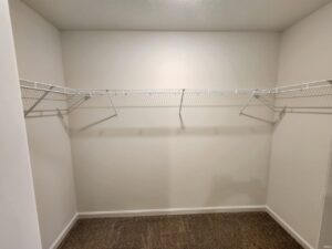 Spacious empty closet storage with wire shelving for organization and easy access.