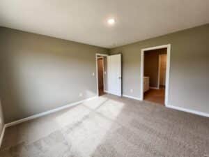 Spacious empty room interior with neutral colors and natural light. Perfect for customization.