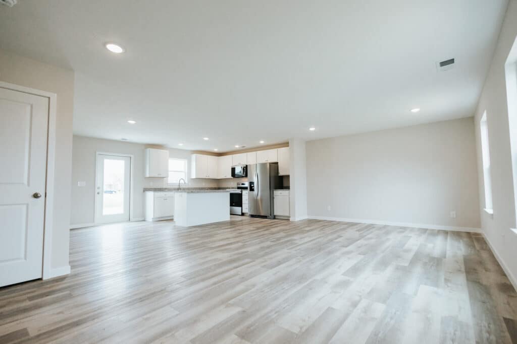 Modern kitchen design featuring stainless steel appliances and spacious, light-filled layout.