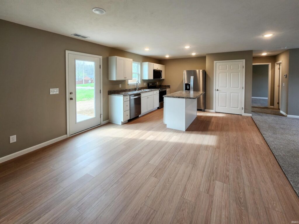Modern kitchen interior with sleek appliances and open layout, perfect for entertaining.