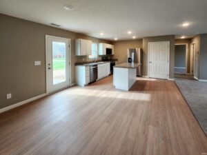 Modern kitchen interior with sleek appliances and open layout, perfect for entertaining.