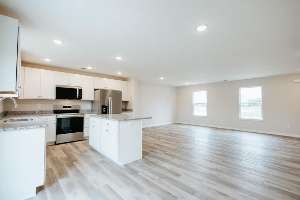 Spacious modern kitchen with sleek appliances and stylish design features.
