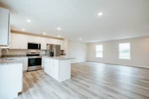 Spacious modern kitchen with sleek appliances and stylish design features.