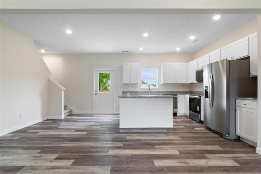 Modern kitchen interior design with white cabinets and open layout for contemporary living.