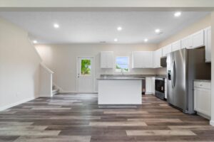 Modern kitchen interior design with white cabinets and open layout for contemporary living.