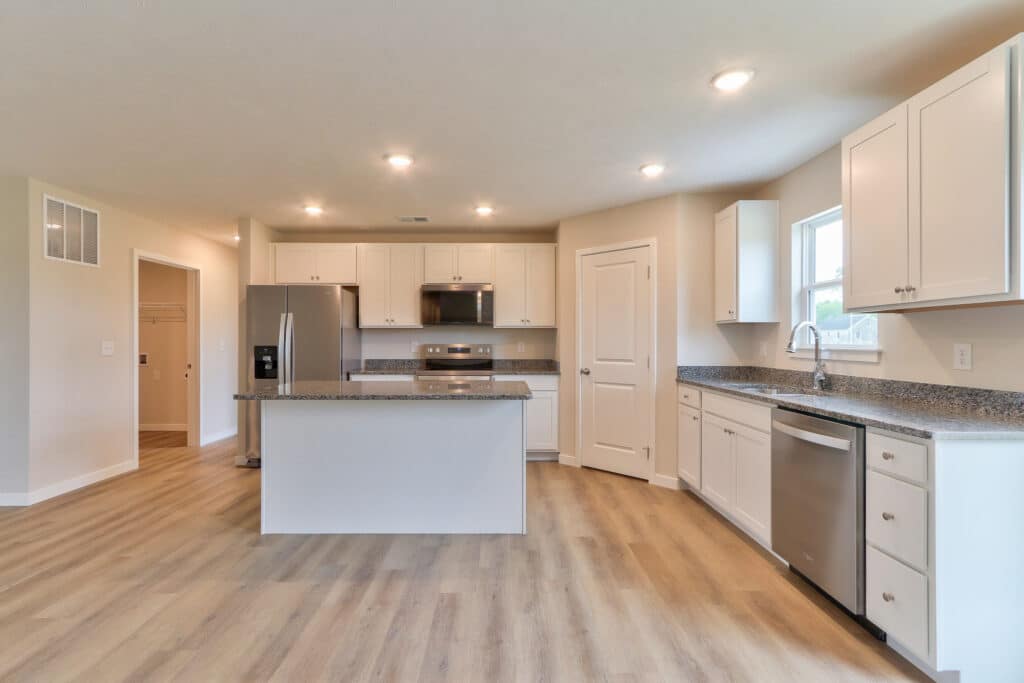 Modern kitchen interior design featuring sleek cabinets and stainless steel appliances.