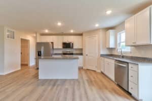 Modern kitchen interior design featuring sleek cabinets and stainless steel appliances.
