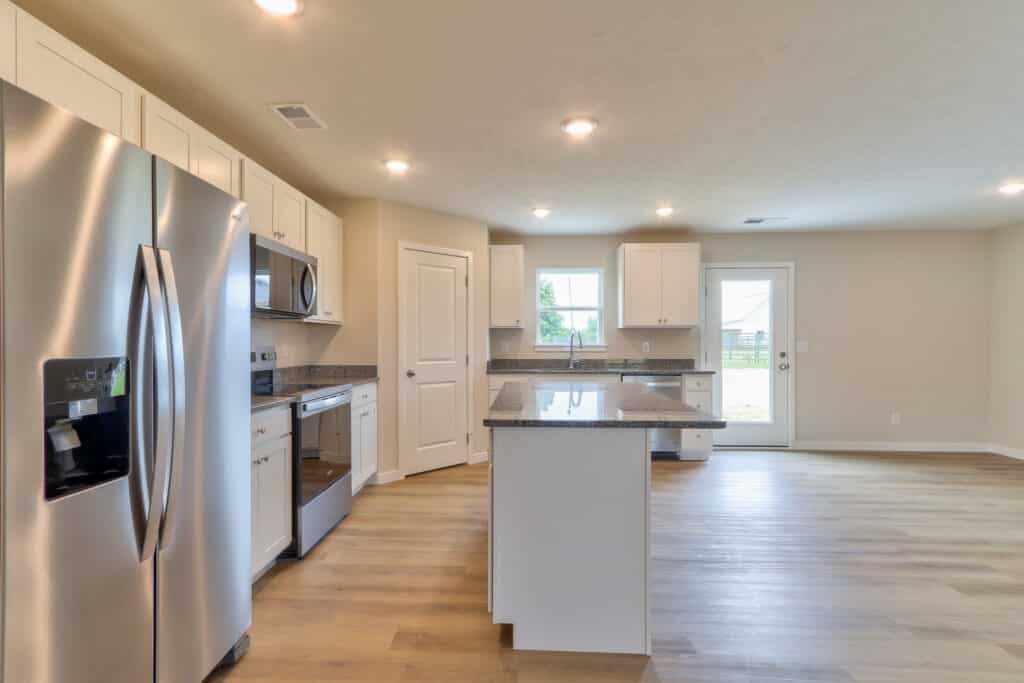 Stylish modern kitchen featuring stainless steel appliances and spacious countertops.