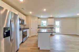 Stylish modern kitchen featuring stainless steel appliances and spacious countertops.