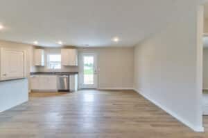 Spacious modern kitchen with sleek cabinetry and natural light.