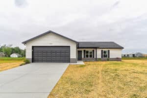 Modern front view of a beautiful new home with a spacious garage.