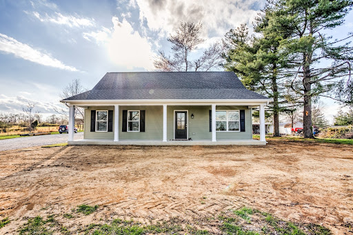 Charming house with a welcoming front view and spacious porch. Perfect for families.
