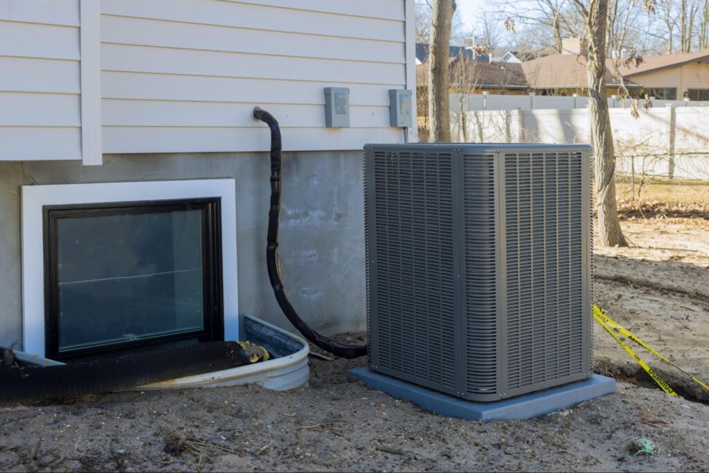 Modern air conditioning unit installed outside a home, ensuring efficient cooling and comfort.