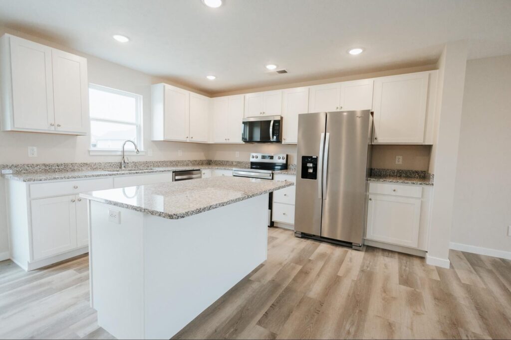 Sleek modern kitchen featuring a stylish island and stainless steel appliances.