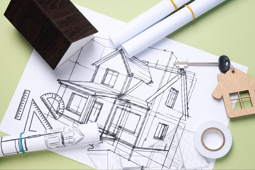 Architectural blueprints and tools for home design and construction projects.
