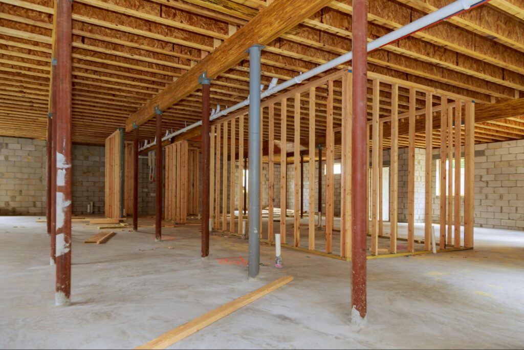 Exposed beams and framing showcase modern construction in an under-renovation building.