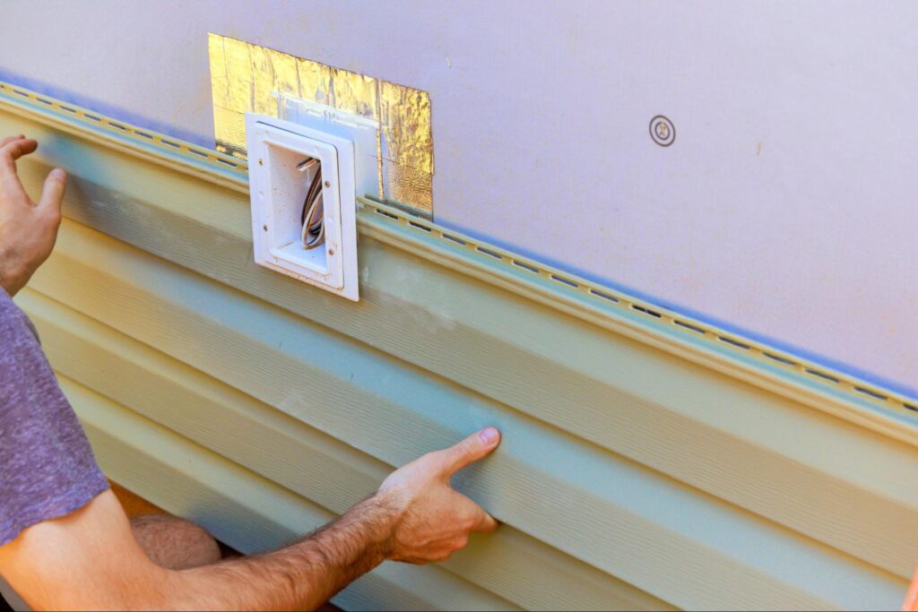 Installing new siding for effective home improvement and renovation.
