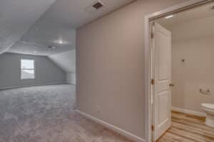 Bright attic space, perfect for creativity and versatile storage solutions.