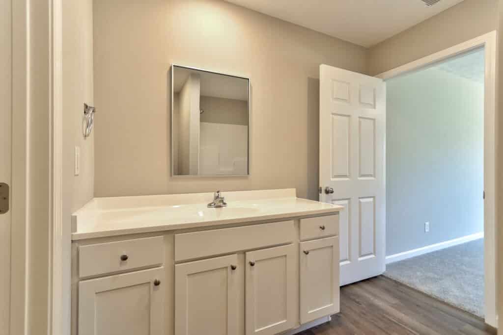 Modern bathroom vanity with stylish sink and ample storage in a clean space.