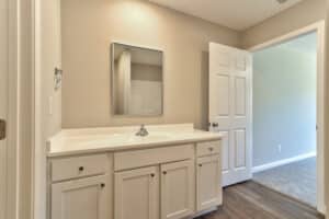 Modern bathroom vanity with stylish sink and ample storage in a clean space.