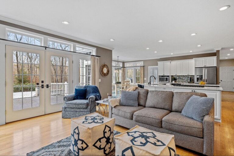 Bright modern living room with cozy furniture and plenty of natural light.