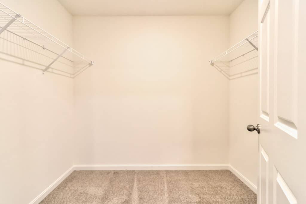 Spacious empty closet with wire shelving, perfect for organization and storage solutions.