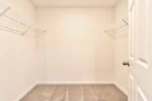Spacious empty closet with wire shelving, perfect for organization and storage solutions.