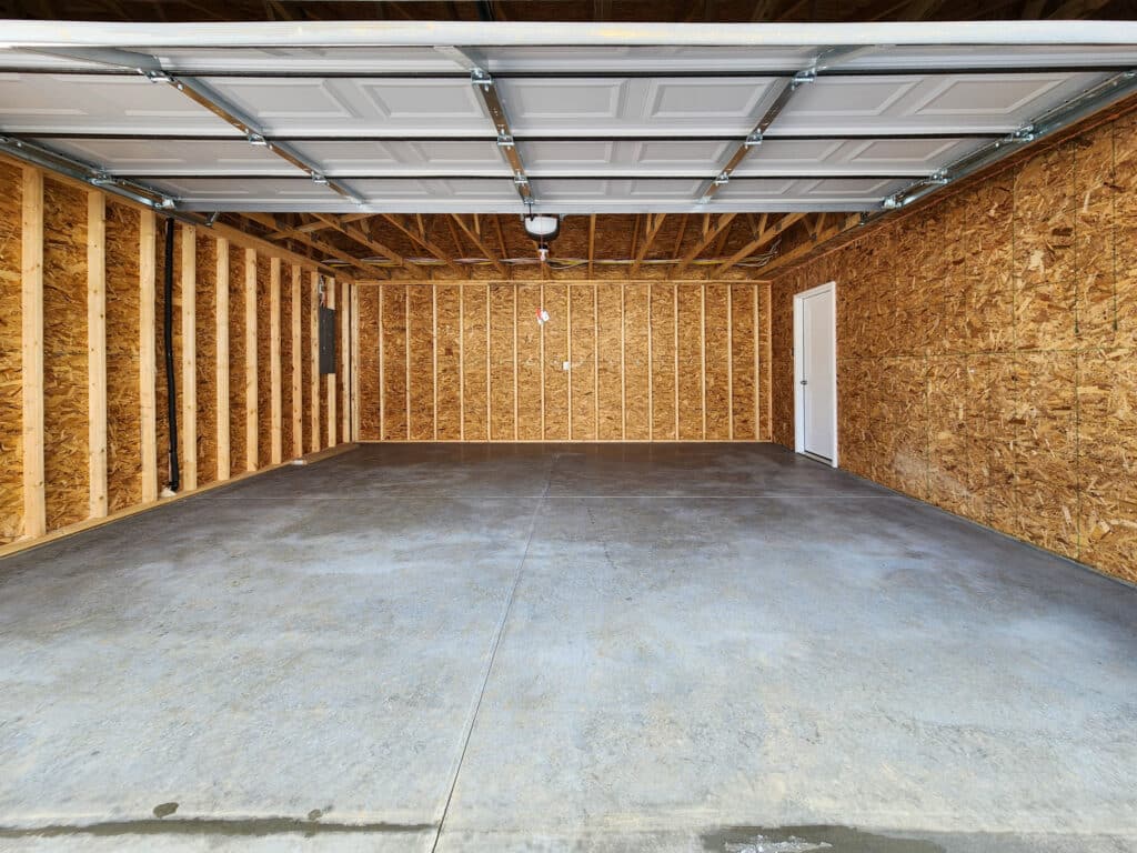 Spacious garage ideal for vehicle storage and efficient organization solutions.