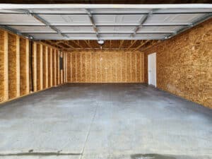 Spacious garage ideal for vehicle storage and efficient organization solutions.
