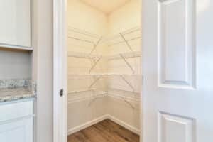 Organized empty pantry with wire shelving for optimal storage solutions.