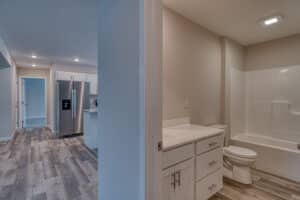 Sleek kitchen and bathroom makeover showcasing modern designs and stylish finishes.