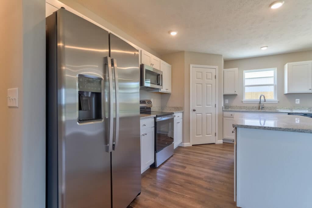 Modern kitchen design featuring stainless steel appliances and sleek cabinetry.
