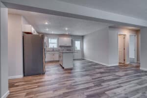 Sleek modern kitchen with hardwood floors and stylish appliances for contemporary living.