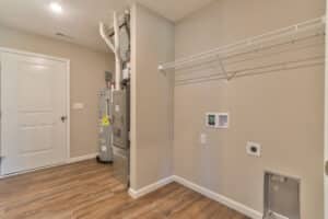 Modern laundry room with utility space and shelves for efficient organization.