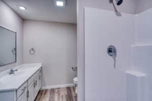 Sleek modern bathroom featuring elegant fixtures and a stylish shower design.