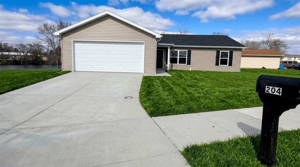 Waterfront home at 204 Carolina Drive with spacious yard and garage for sale.