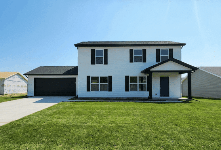 Charming two-story home with large yard and garage for sale.