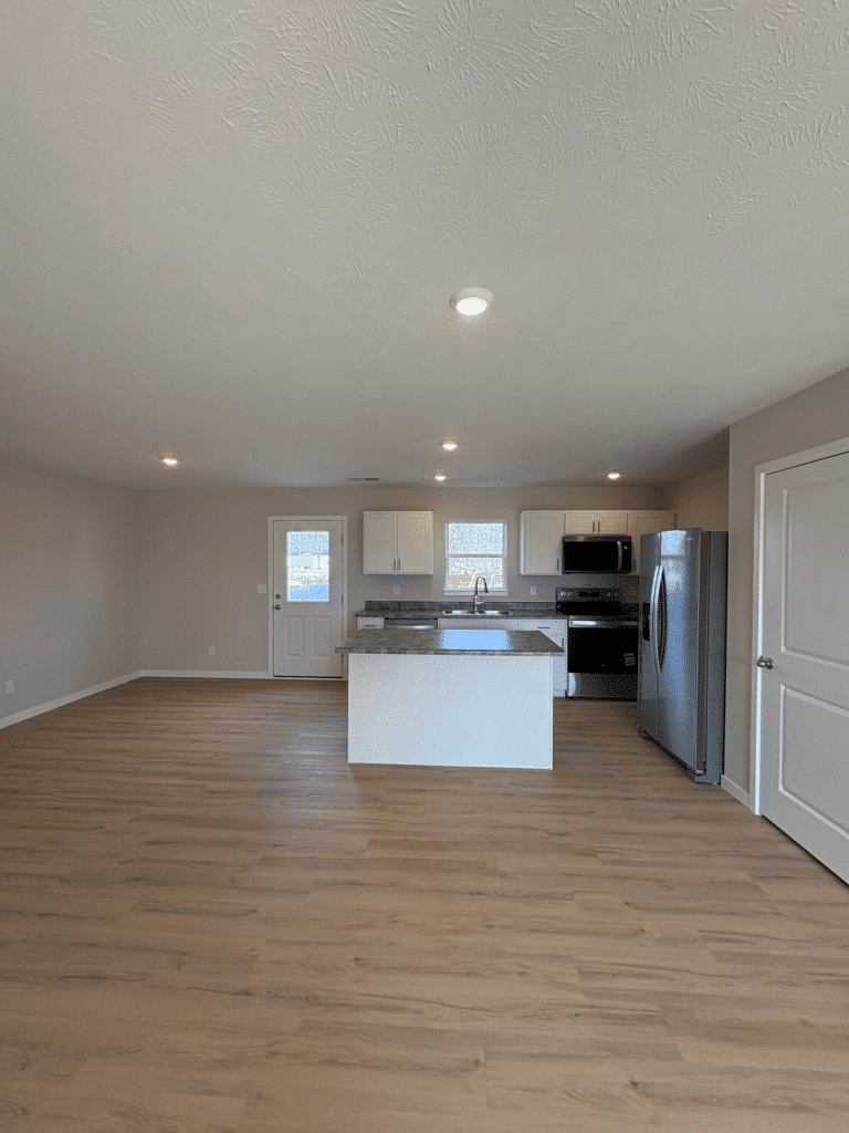 Spacious modern kitchen with bright design and sleek appliances. Perfect for entertaining.