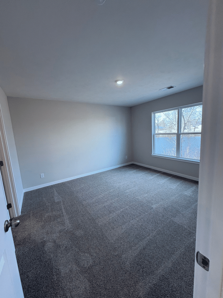 Bright, spacious room with scenic views and new carpet, perfect for relaxing living.
