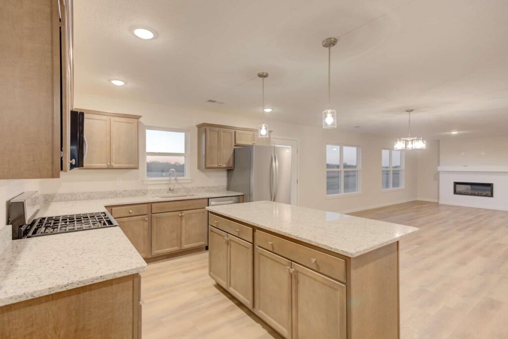 Stylish open-concept kitchen with granite island, perfect for modern living and entertaining.