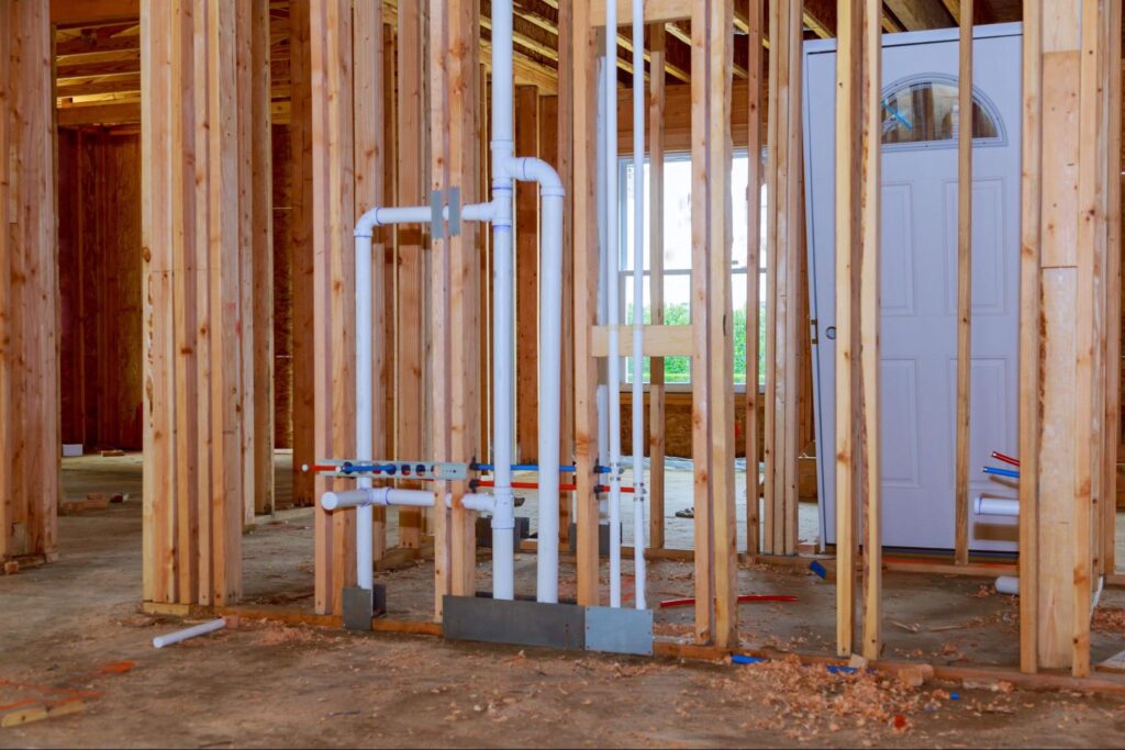 Framing and plumbing installation in a new construction home.